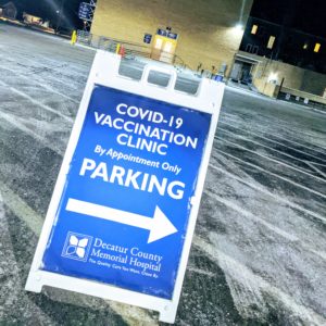 a vaccine parking sign